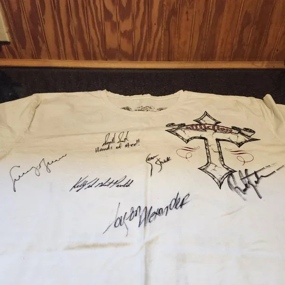 Brand new affliction shirt with fighters signatures